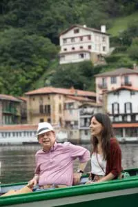 Here's an alt tag for the image: Smiling couple enjoying a boat ride.