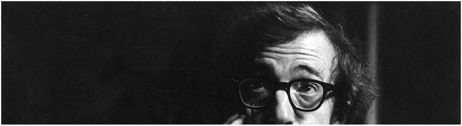 Black and white portrait of Woody Allen.