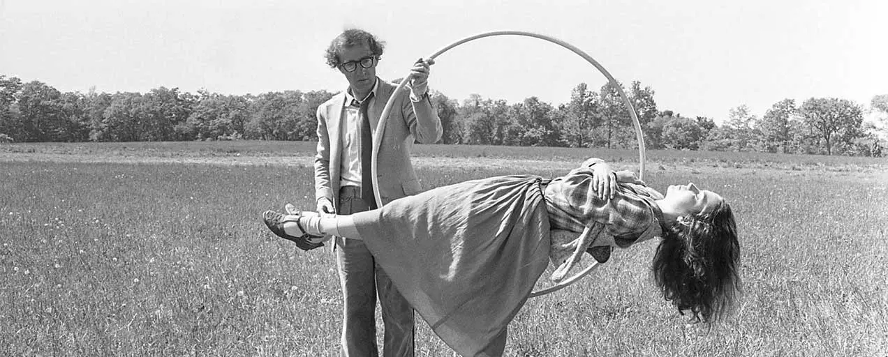 Woody Allen and a woman with a hoop.