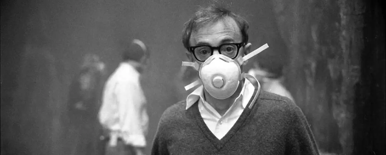 Woody Allen wearing a respirator mask.