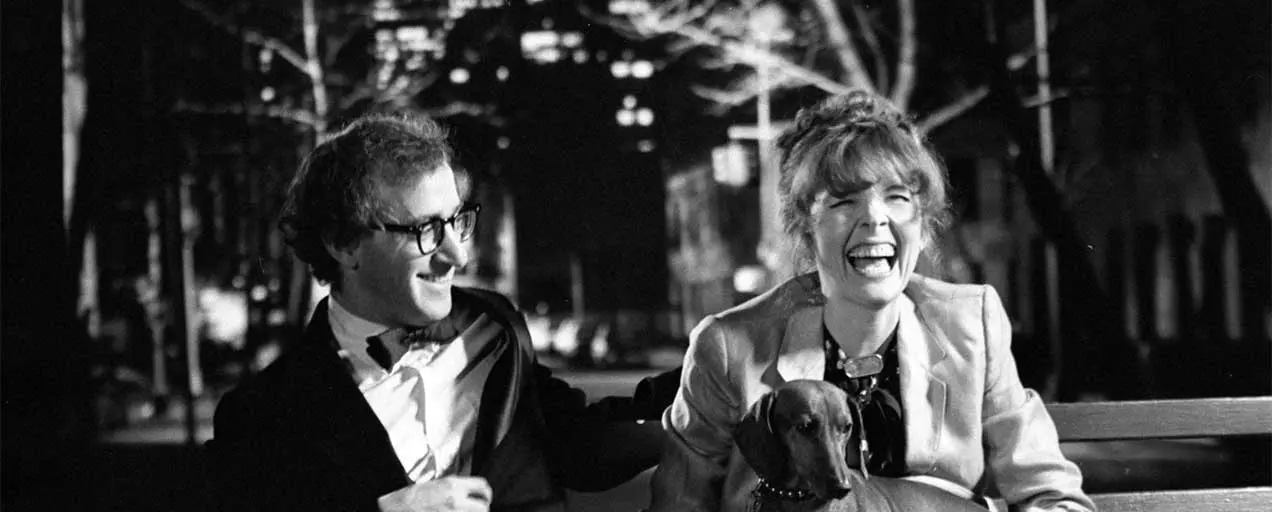 Woody Allen and Diane Keaton on a bench.