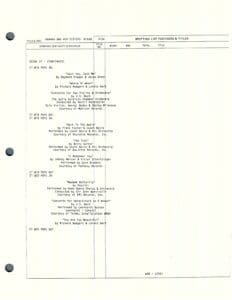 Document with text and columns, hole-punched.